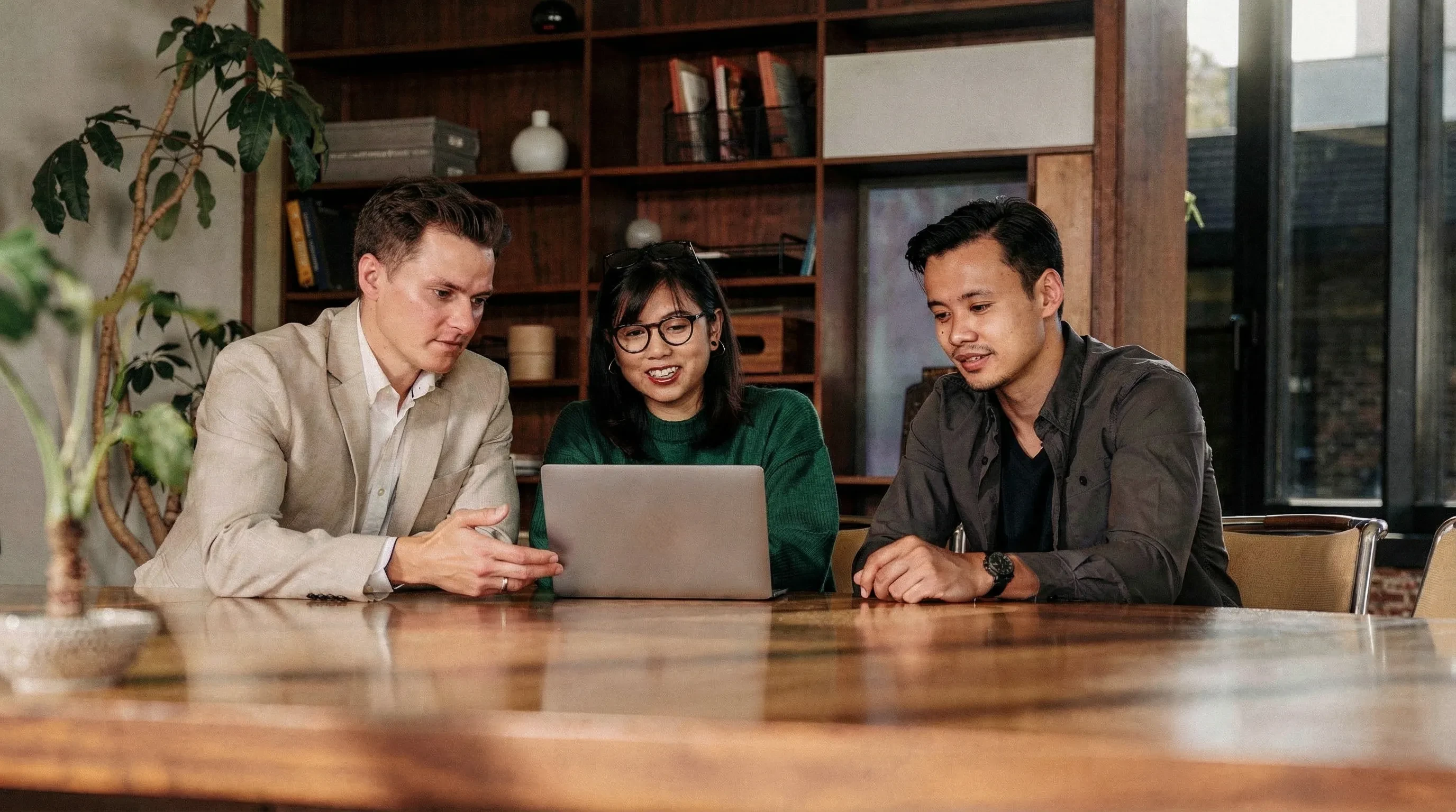 Team collaborating on a laptop